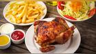 Pollo a la brasa con papas, ensalada y cremas