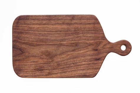 Tabla de madera de nogal, una madera sólida que evita la absorsión de material residual.    